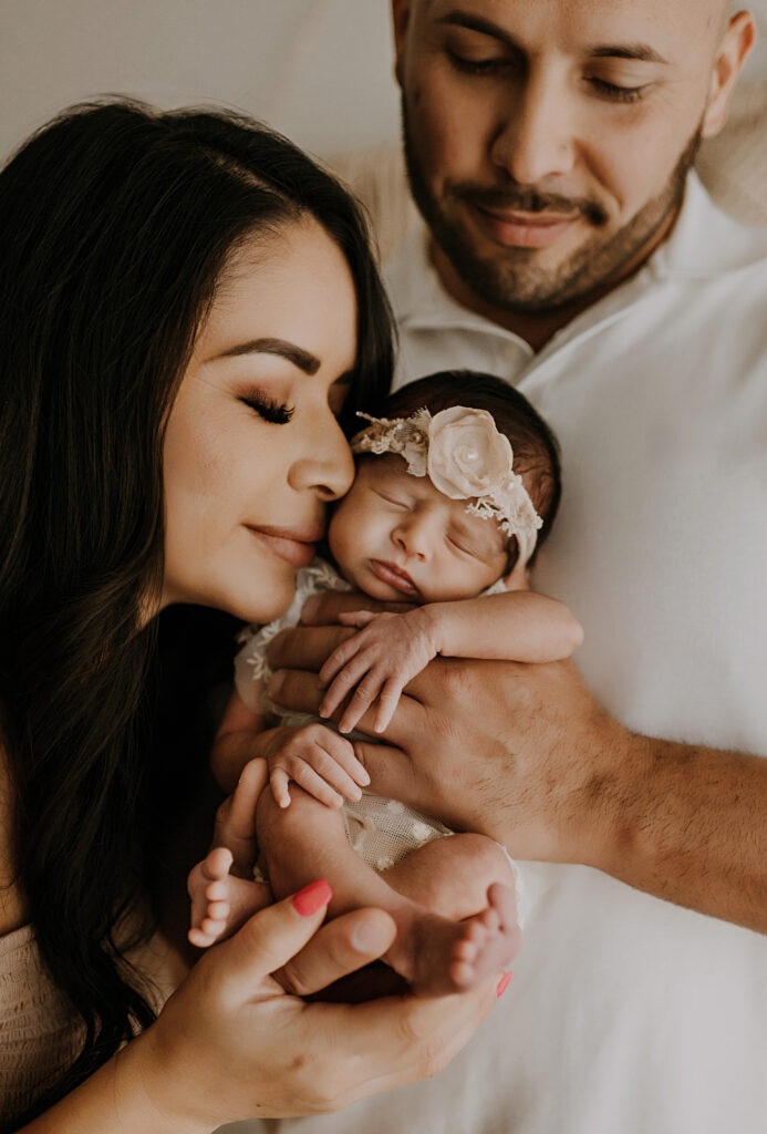 Dallas family snuggling in for their studio newborn session 