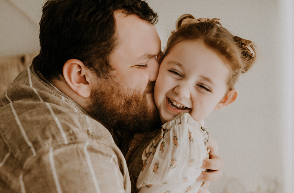 Dad and daughter smiling in Dallas Texas