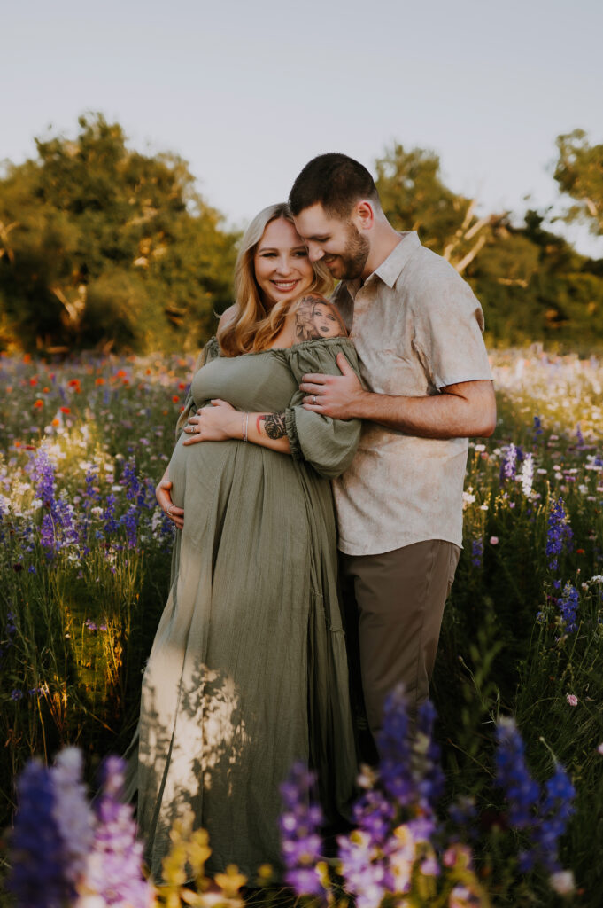 Dallas mother-to-be snuggled up with husband in lavender field 