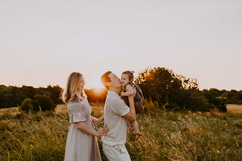 Family of three in dallas Texas during a sunset session.