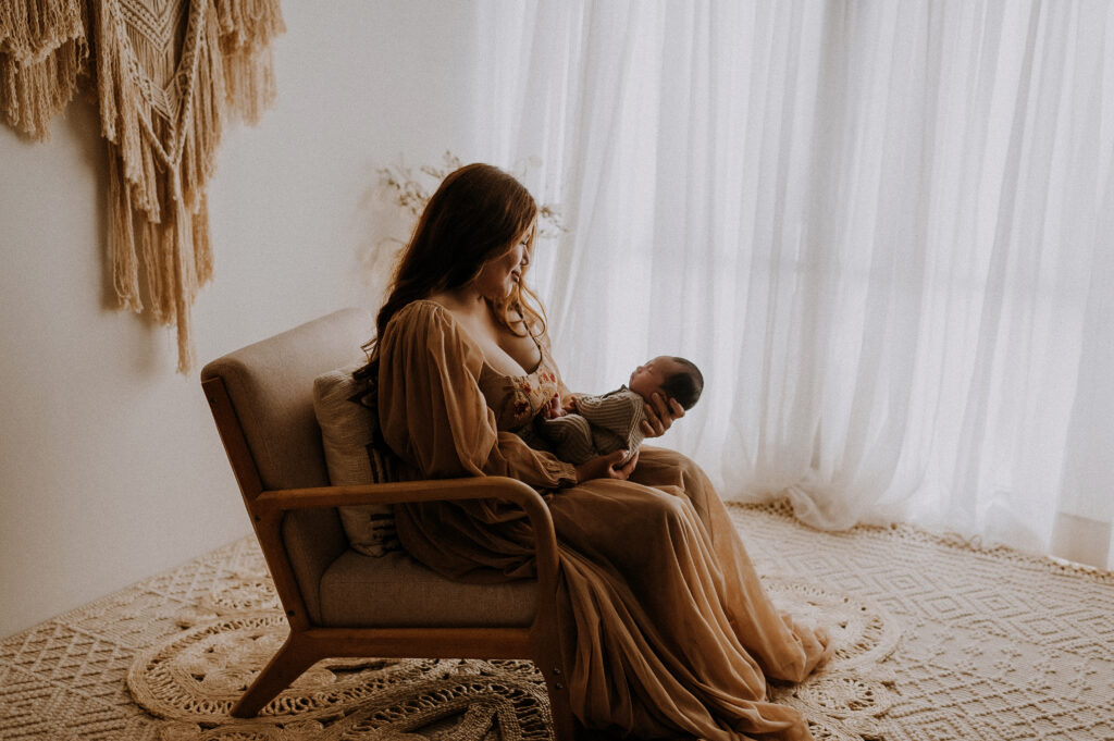 Mom and baby cuddled in a Fort Worth studio