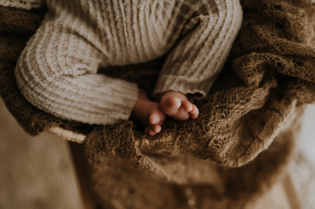 A baby's toes in a baby basket in fort worth, texas